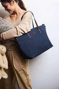 Baby and mom carrying the navy blue and dark brown diaper bag by O My Bag.