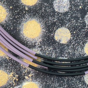 NECKLACE OF 6 STAINLESS STEEL STRINGS AND COLORFUL RUBBER TUBES