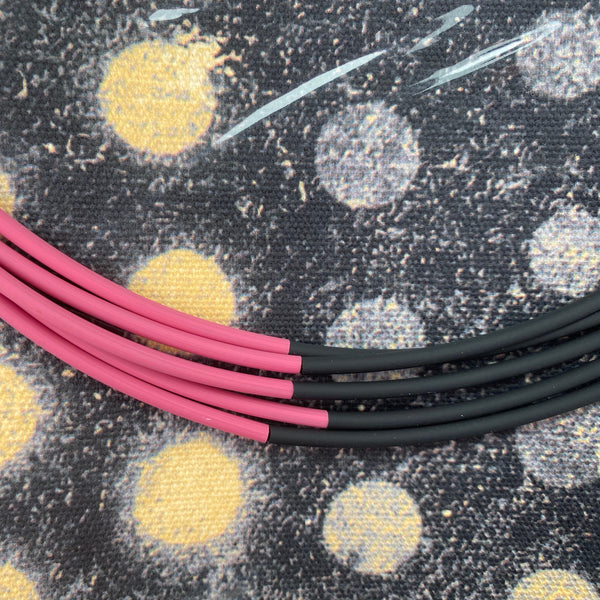 NECKLACE OF 6 STAINLESS STEEL STRINGS AND COLORFUL RUBBER TUBES