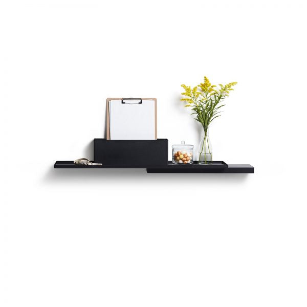 Black Duplex Shelf by Puik against a white background. Decorated with plants and a clipboard.